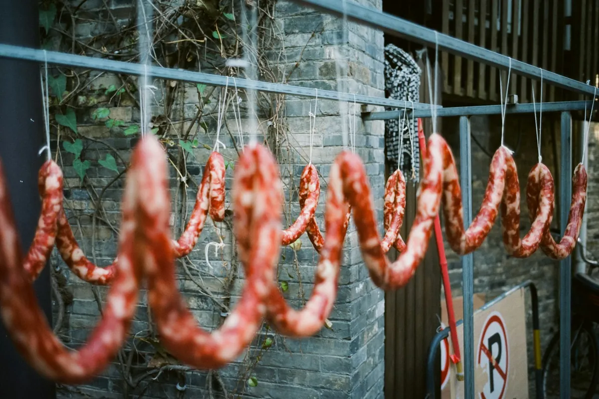 Sausage links hanging to air-dry