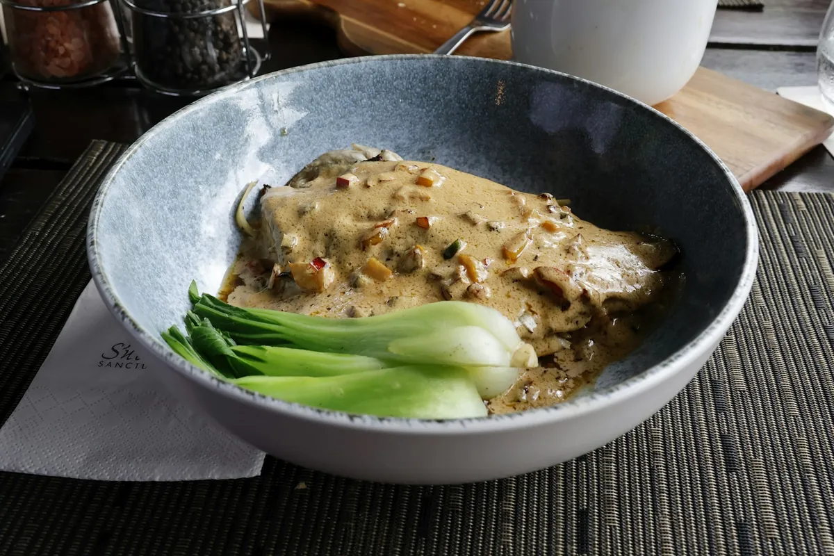 A scallop dish plated as a main course
