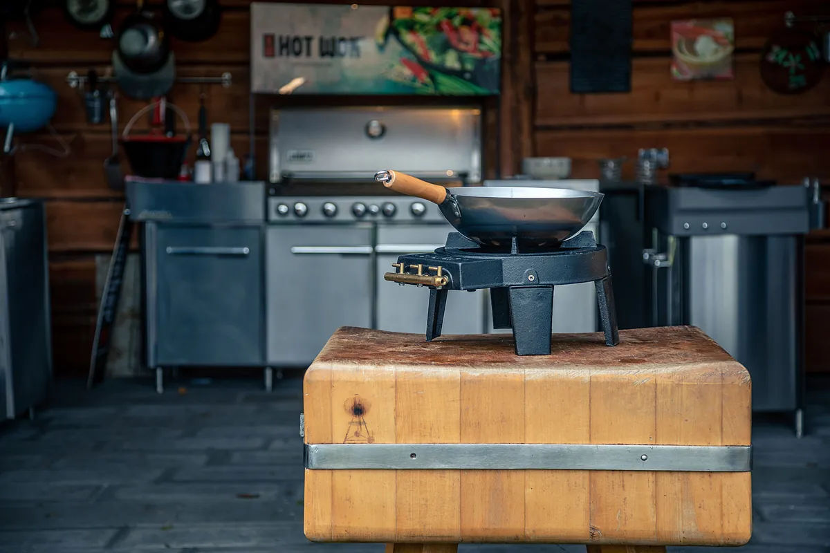The darkened surface of a seasoned carbon steel pan