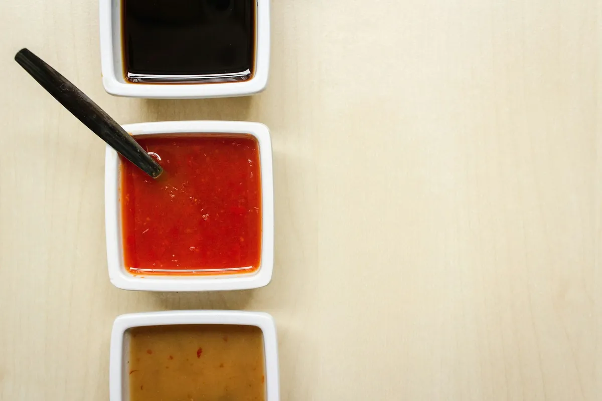 Several Chinese sauces in small bowls