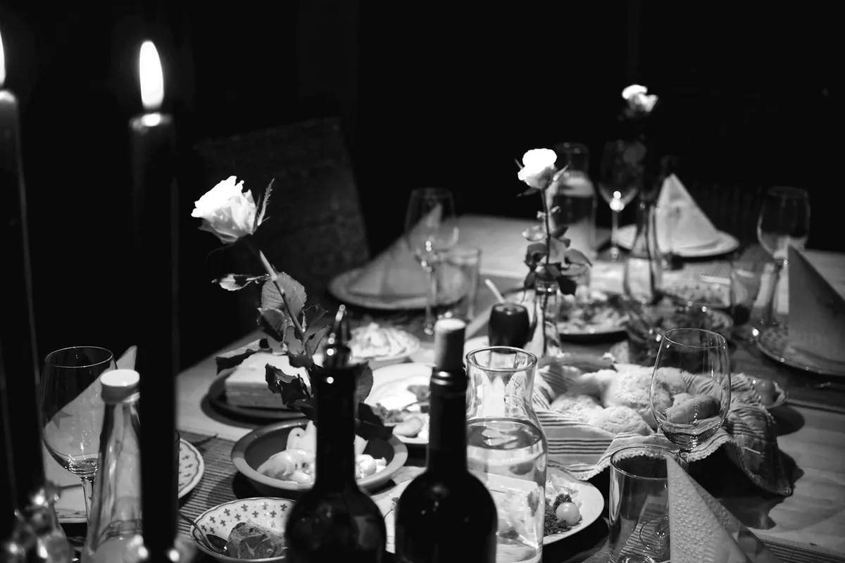 A group meal with multiple shared dishes in the center of the table