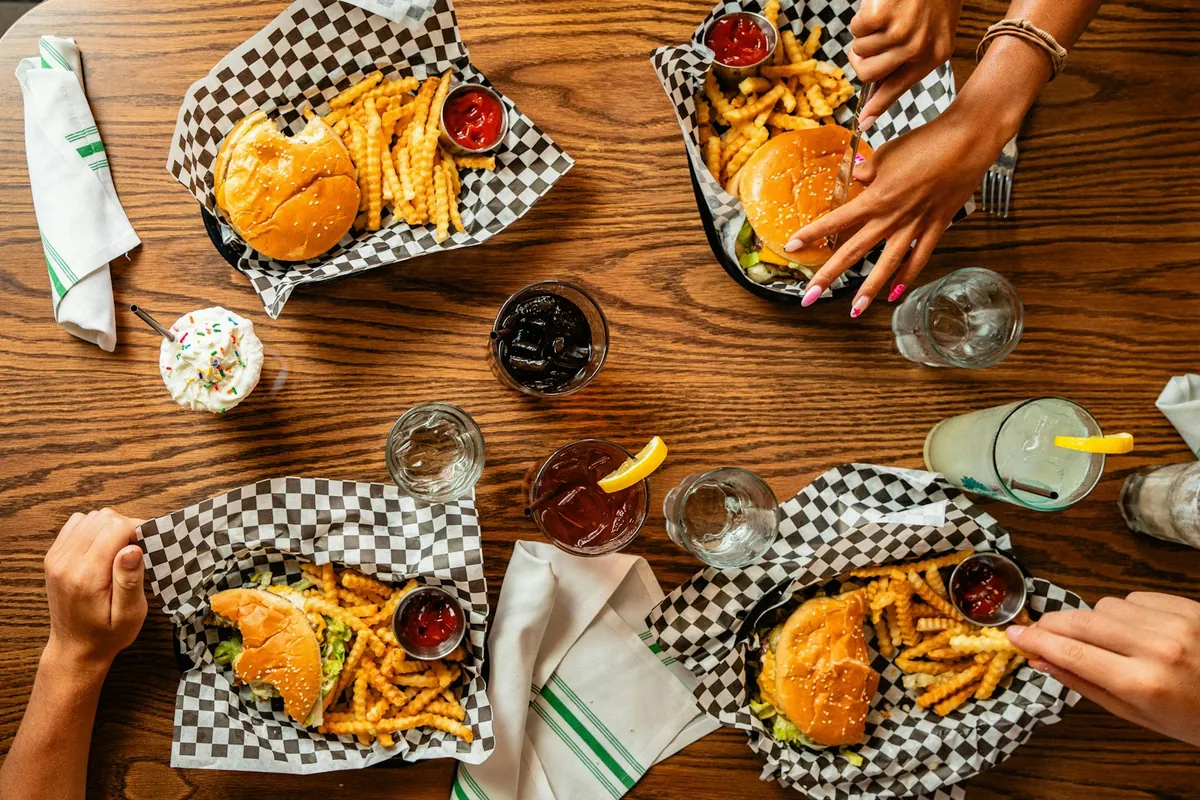 Four people sharing a Chinese meal