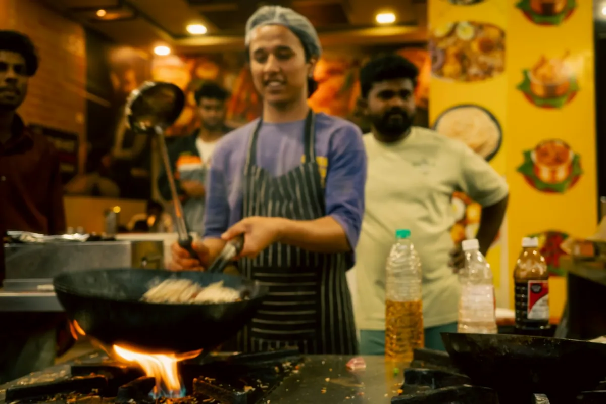 A wok being used in a restaurant kitchen