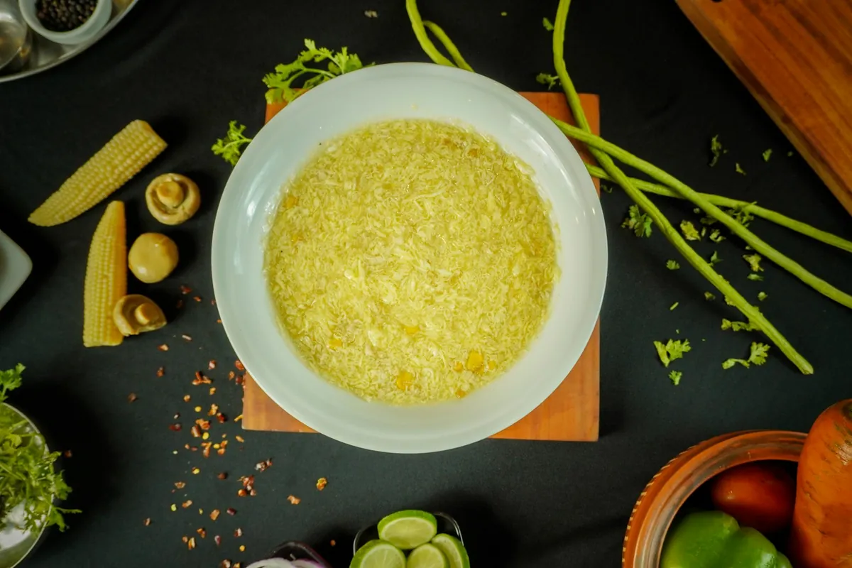 Shrimp served in a pale, egg-thickened sauce