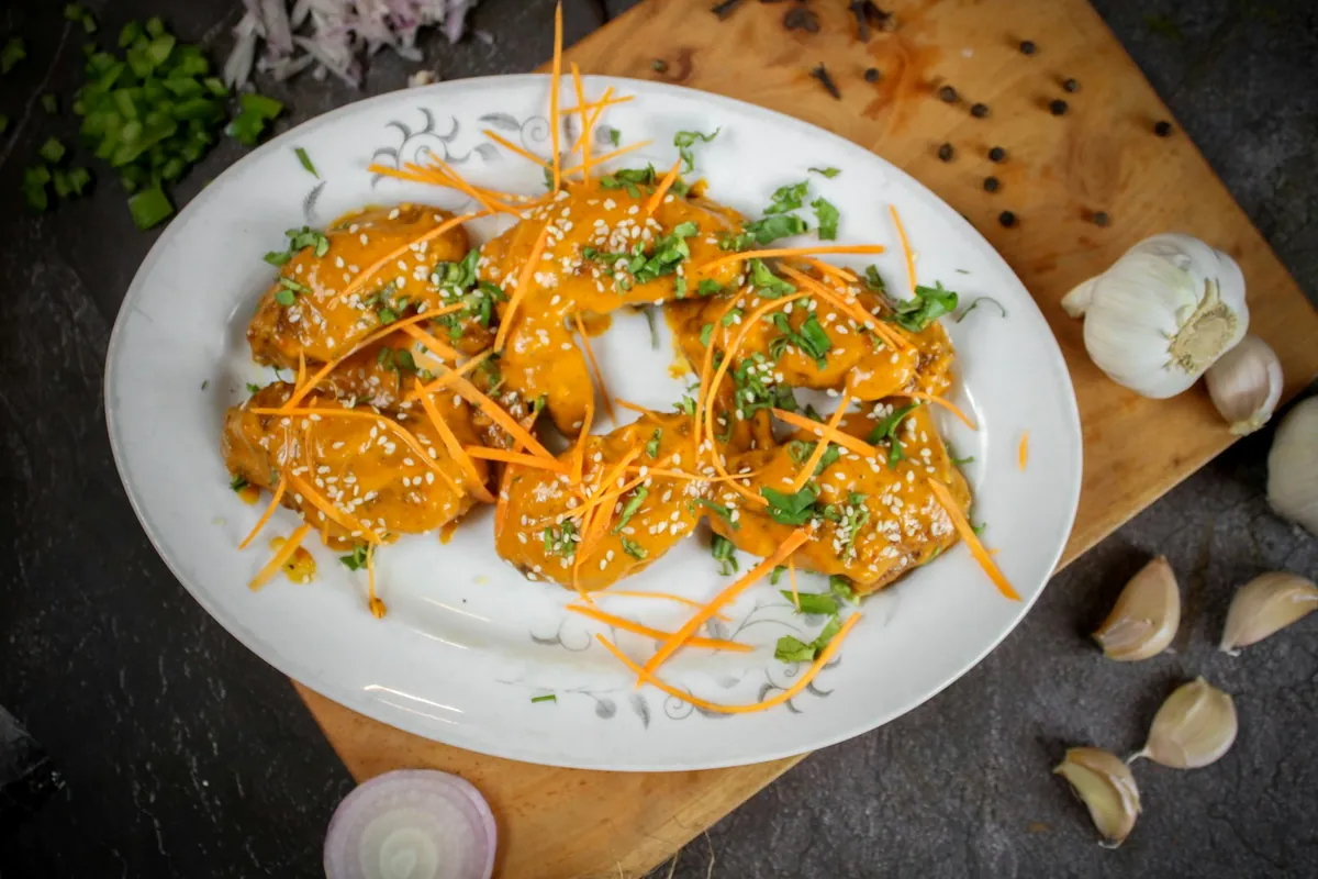 Thinly sliced chicken cooking quickly over heat