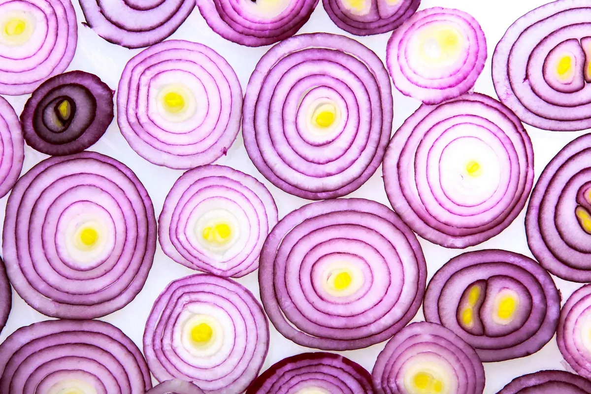 Sliced onions cooking in a pan