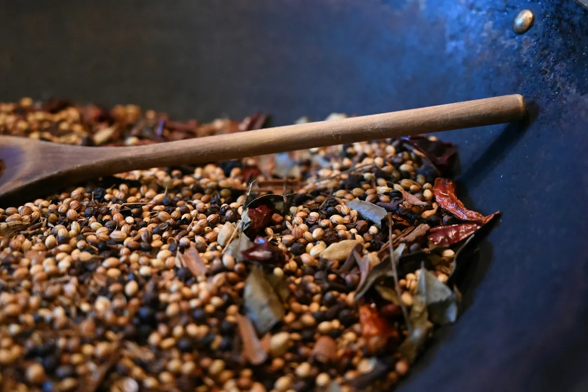 A pot simmering slowly with the lid ajar
