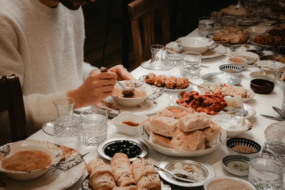 A large bowl of soup set out on a table for sharing