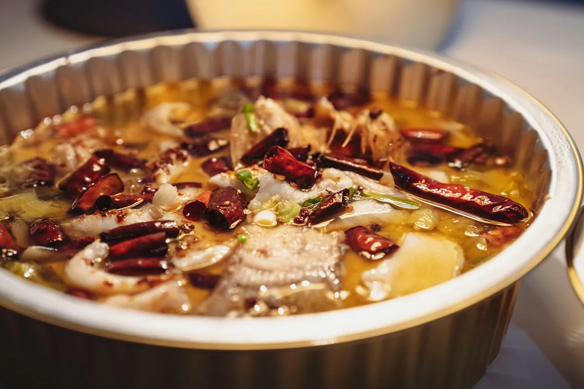 A close view of a spicy chili hot pot broth