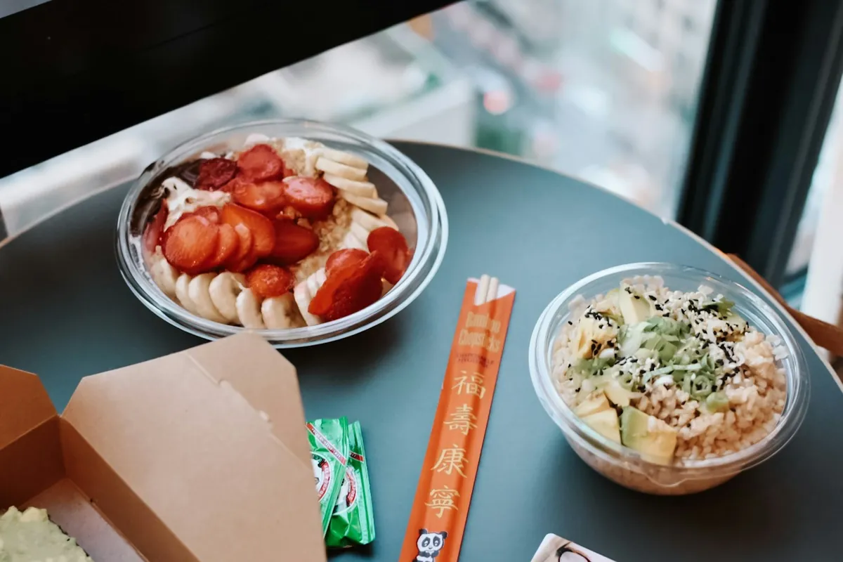 A steamed dish packed in a takeout container