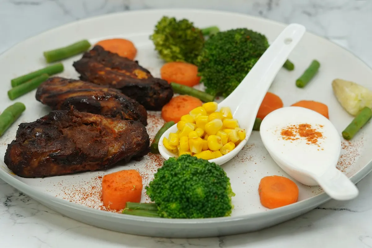 A close view of dark glazed chicken pieces