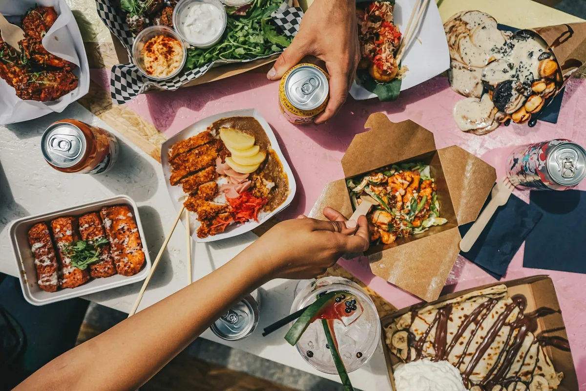 Takeout containers opened on a table at home