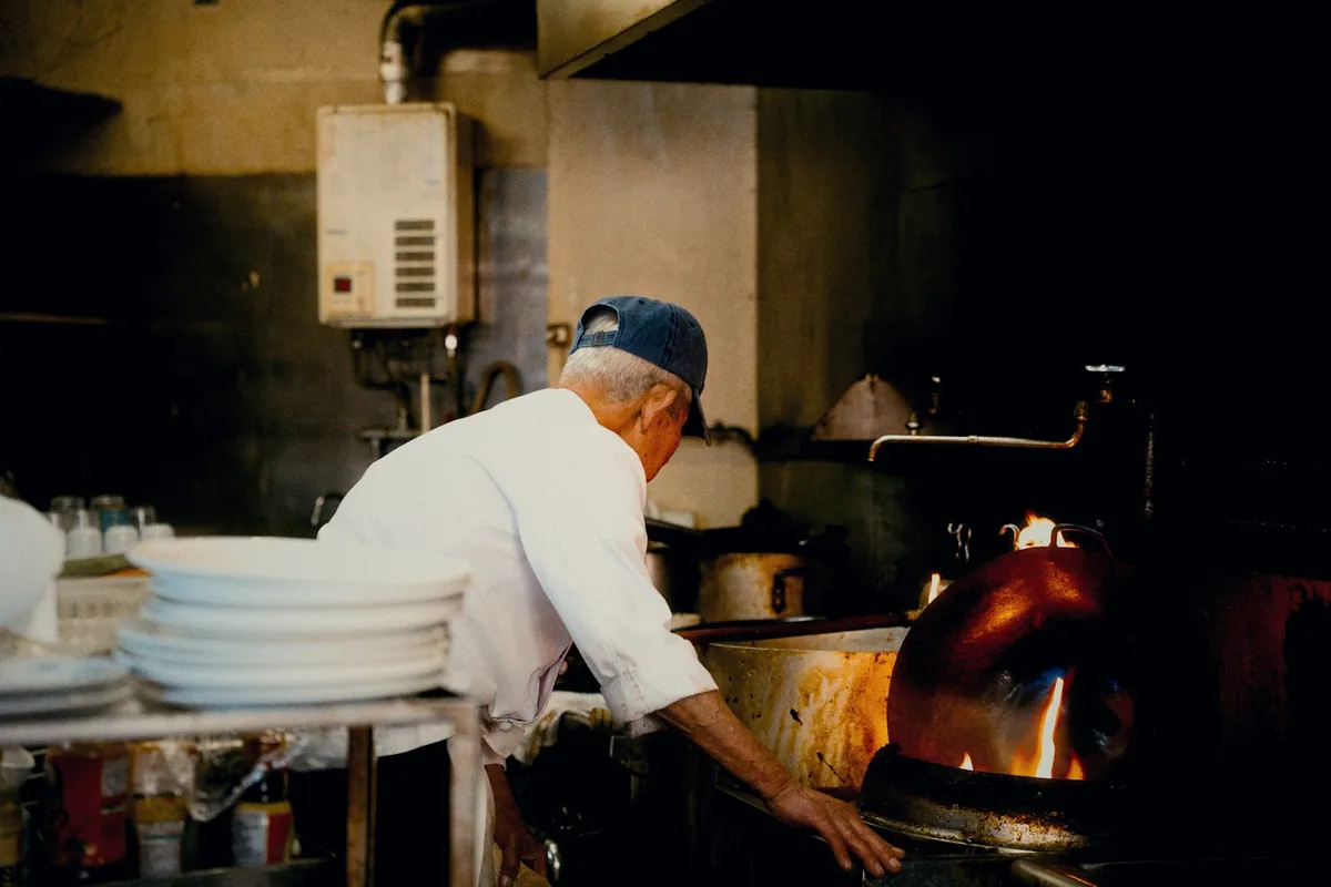 A wok over a powerful flame