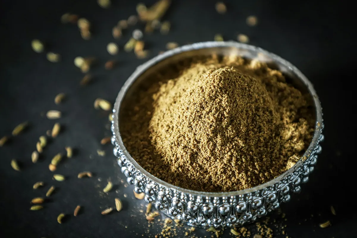 Bright yellow mustard beside ground mustard powder